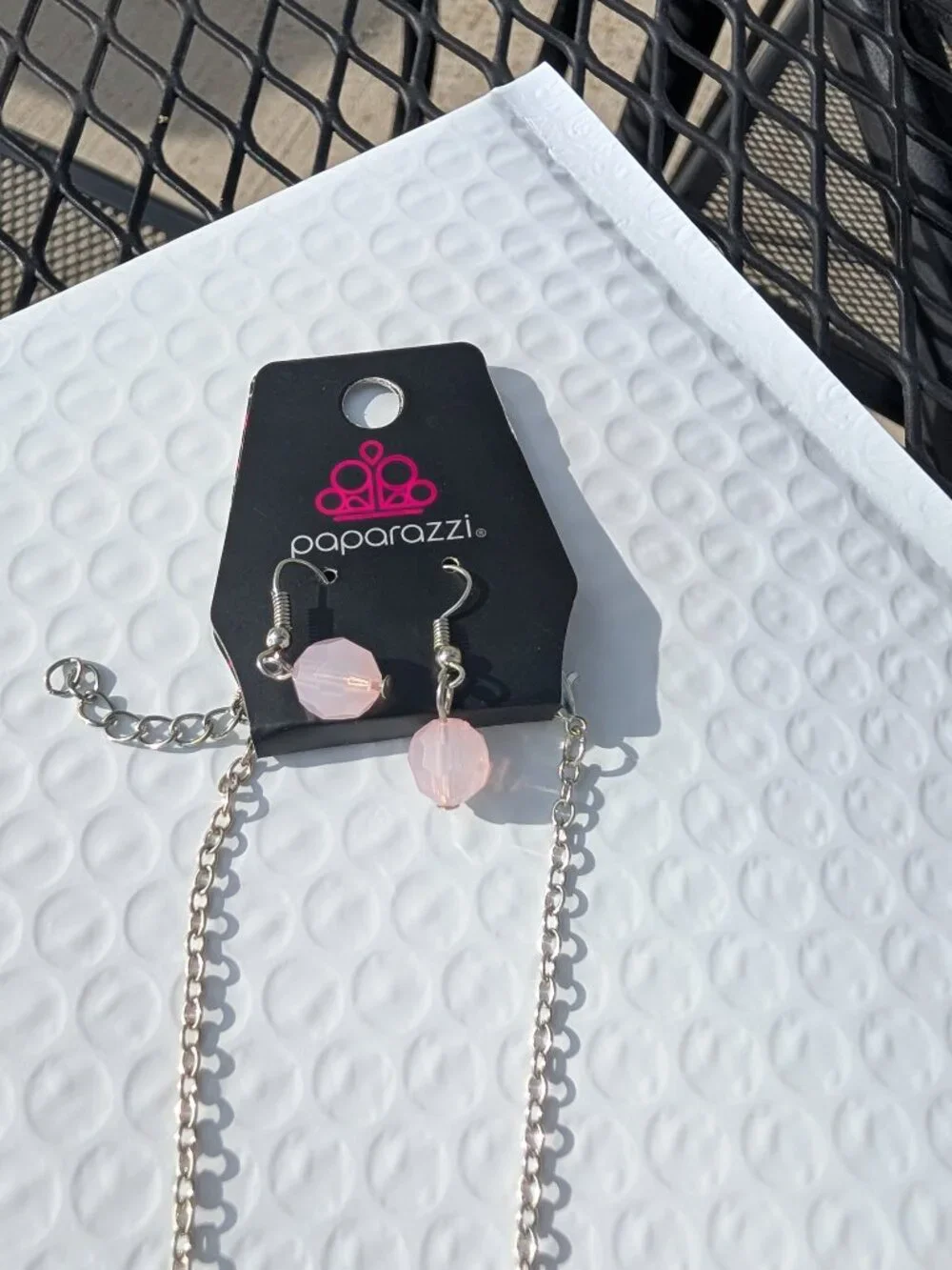 Light pink paparazzi necklace with matching earings set.